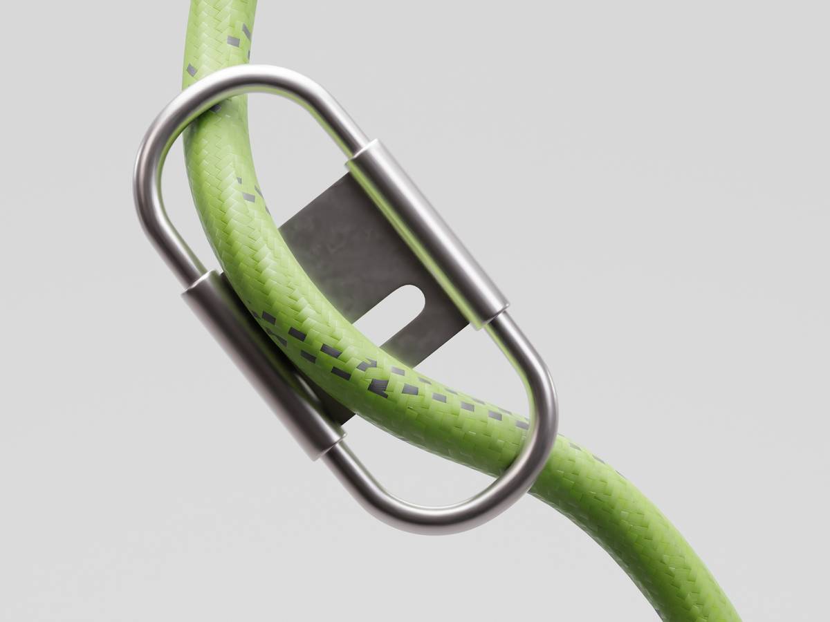 types of belay devices including tubular, assisted-braking, and figure-eight models laid out on a climbing rope